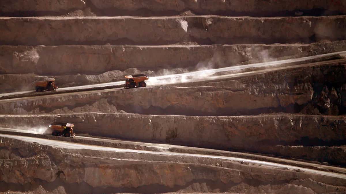 Haul trucks on the benches of the Escondida open pit