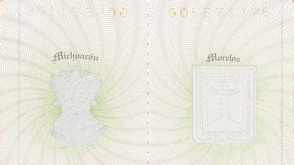 Inside pages of a Mexican passport showing state coats of arms