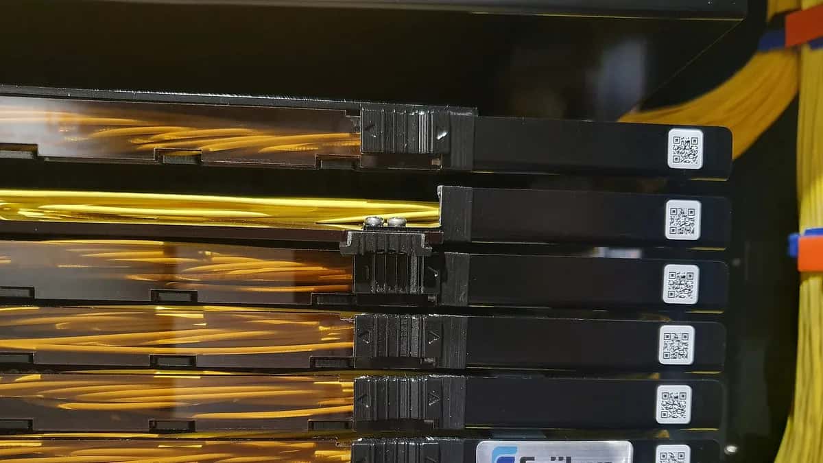 Fiber optic cables connected to telecommunications equipment